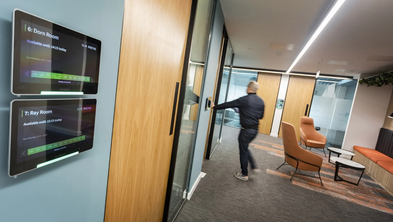 Meeting room with someone walking in